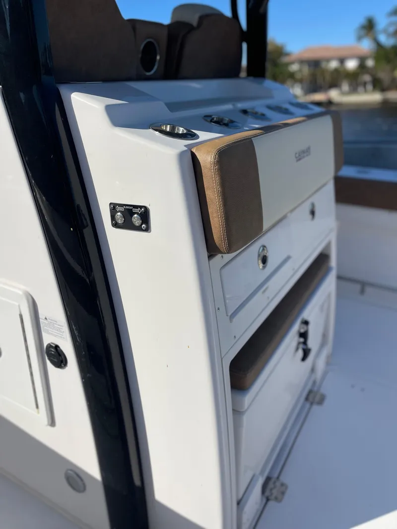 Slide: The Image of 2022 Caymas 341 CC boat console with storage compartments and seating. - 21