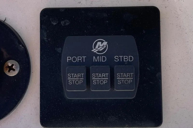 Slide: The Image of Control panel with start/stop buttons for Caymas 341 CC boat, 2022 model. - 39