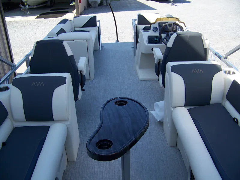 Slide: The Image of 2025 Avalon VENTURE QUAD LOUNGER interior with luxurious seating and modern helm. - 12
