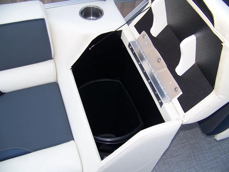 Slide: The Image of Avalon VENTURE QUAD LOUNGER 2025 seat storage with cup holder, open compartment view. - 13