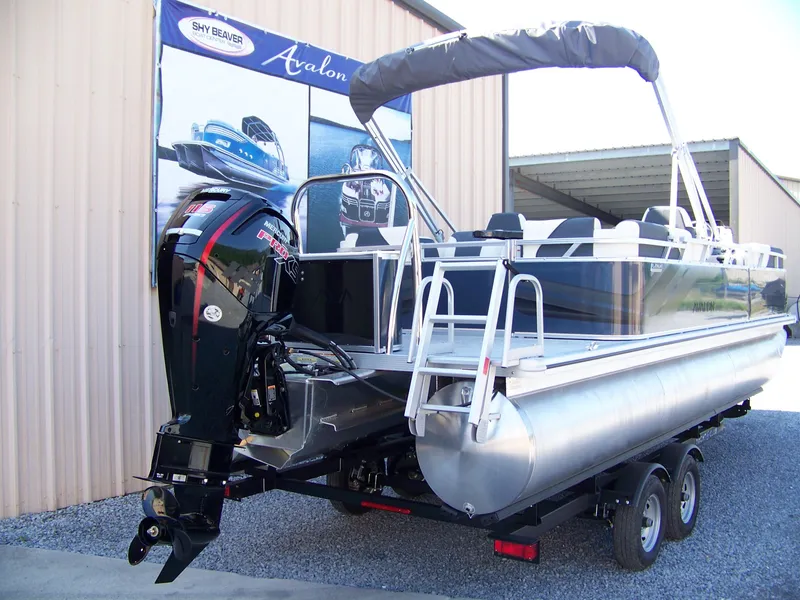 Slide: The Image of 2025 Avalon VENTURE QUAD LOUNGER pontoon boat on trailer, featuring Mercury Pro XS engine. - 3