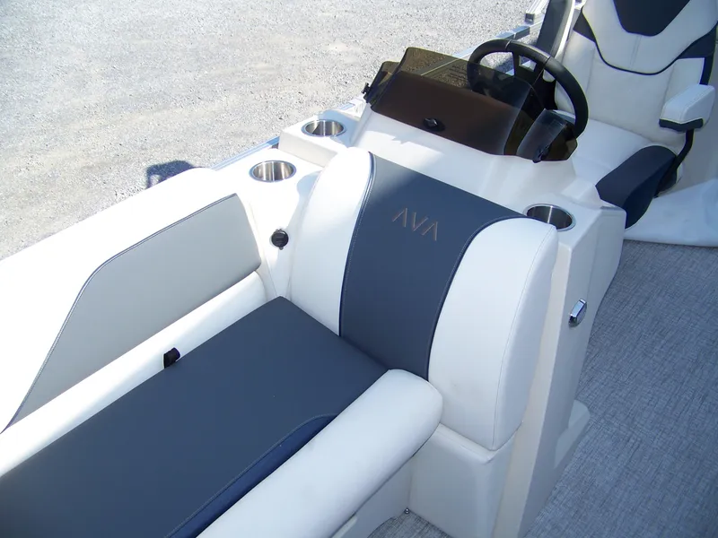 Slide: The Image of 2025 Avalon VENTURE QUAD LOUNGER interior with steering wheel and cup holders. - 6