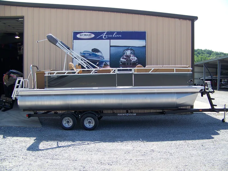 The Image of 2025 Avalon VENTURE CRUISE pontoon boat on trailer outside dealership. - 1
