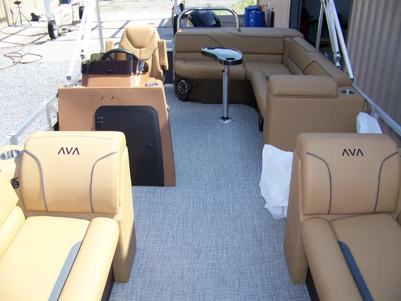 Slide: The Image of 2025 Avalon VENTURE CRUISE pontoon boat interior with tan seating and modern design. - 4