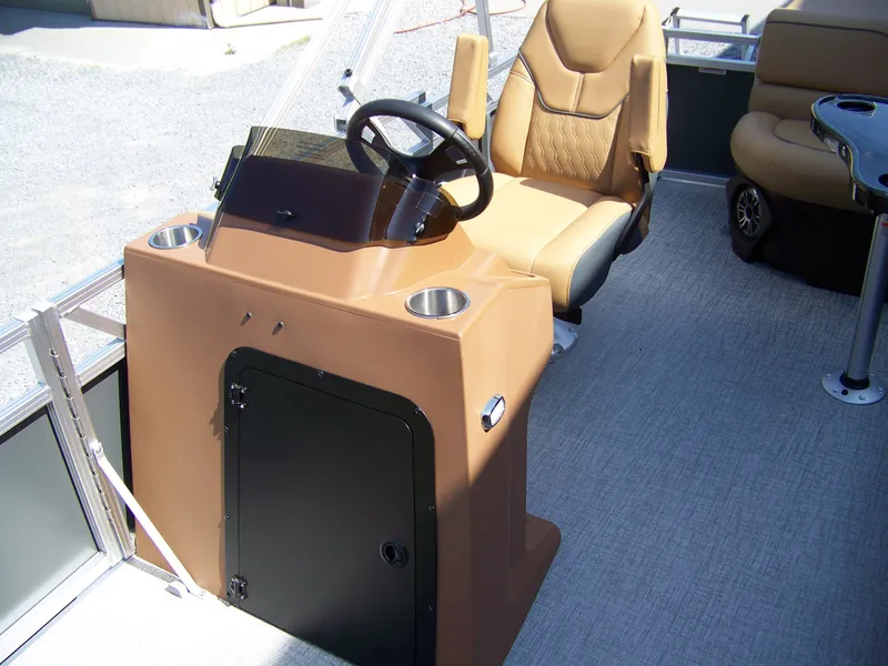 Slide: The Image of 2025 Avalon VENTURE CRUISE boat interior with steering console and comfortable seating. - 6