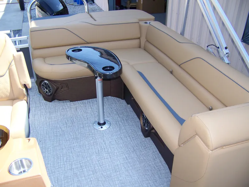 Slide: The Image of Luxurious seating area on 2025 Avalon VENTURE CRUISE pontoon boat with sleek table design. - 8