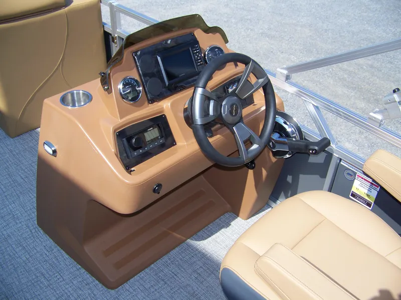 Slide: The Image of 2025 Avalon VENTURE CRUISE boat dashboard with steering wheel and controls. - 9