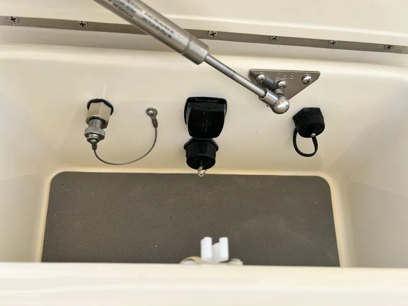 Slide: The Image of 2025 Scout 357 LXF boat compartment with hydraulic support and electrical connections. - 21