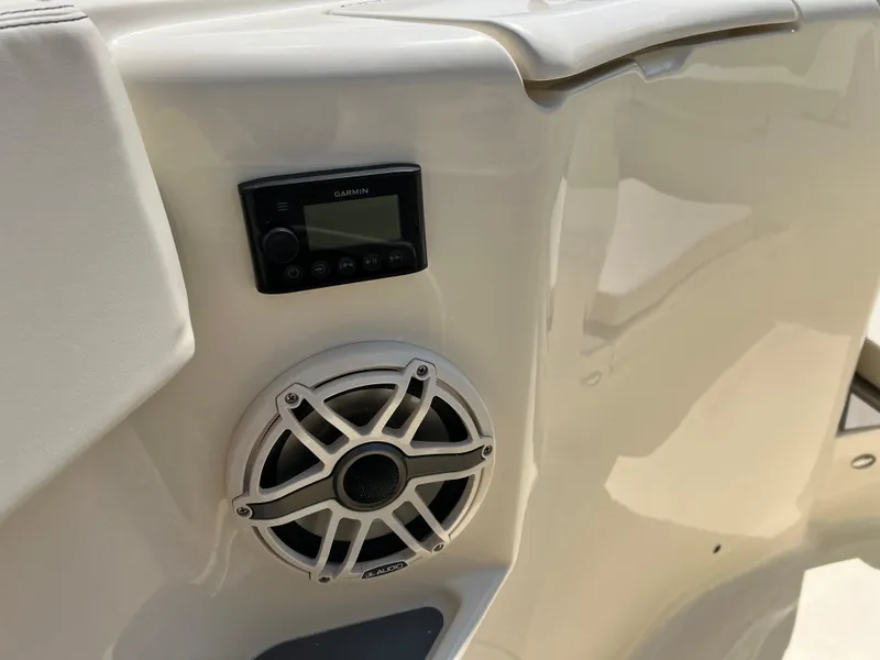 Slide: The Image of 2025 Scout 357 LXF boat with Garmin audio system and speaker detail. - 23