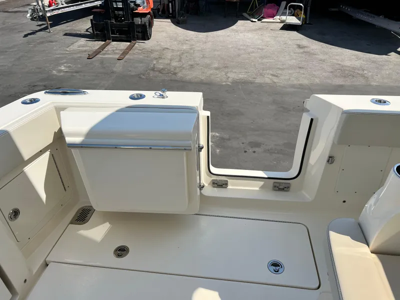 Slide: The Image of 2025 Scout 357 LXF boat deck with seating and storage compartments. - 9