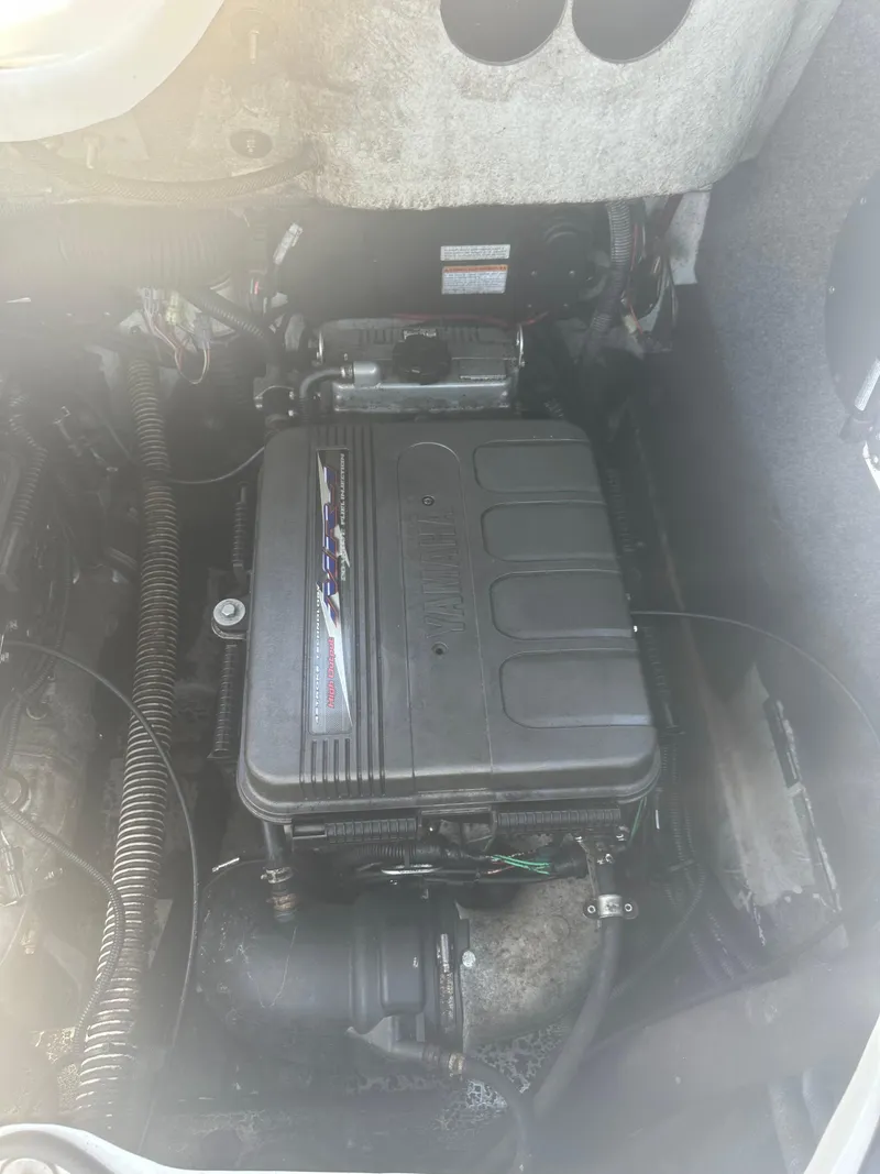 Slide: The Image of 2010 Yamaha Boats 212SS engine compartment, showcasing internal components and wiring. - 11