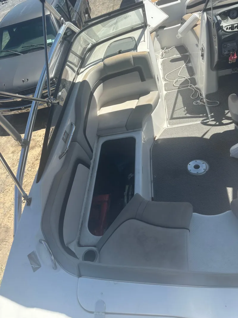 Slide: The Image of 2010 Yamaha Boats 212SS interior with seating and storage compartments. - 17