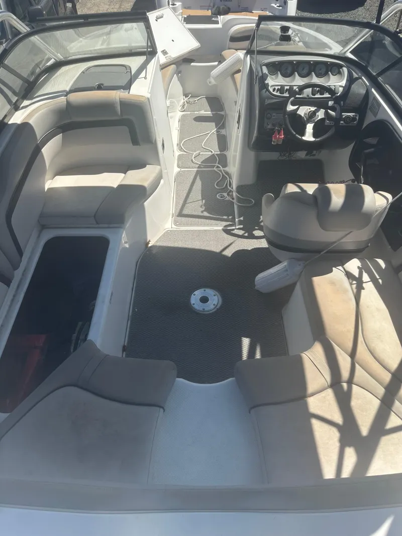 Slide: The Image of 2010 Yamaha Boats 212SS interior with seating, steering wheel, and dashboard. - 18
