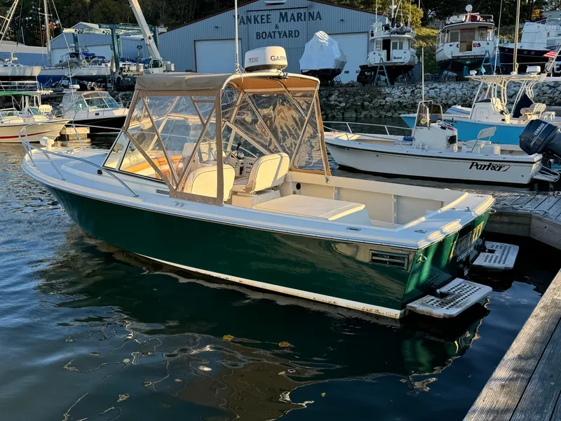 Slide: The Image of 2004 Limestone 24 Cuddy boat docked at a marina. - 13