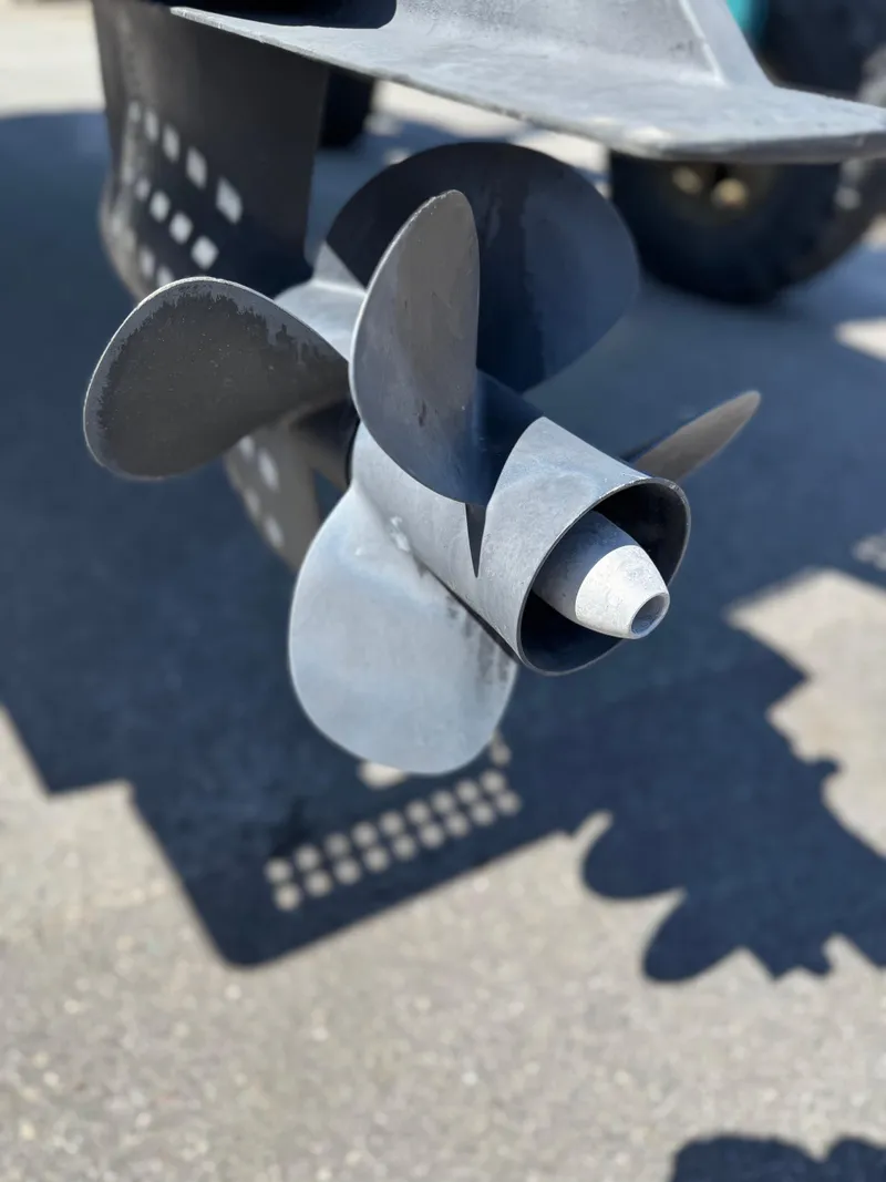 Slide: The Image of Close-up of a 2004 Limestone 24 Cuddy boat propeller on a sunny day. - 3