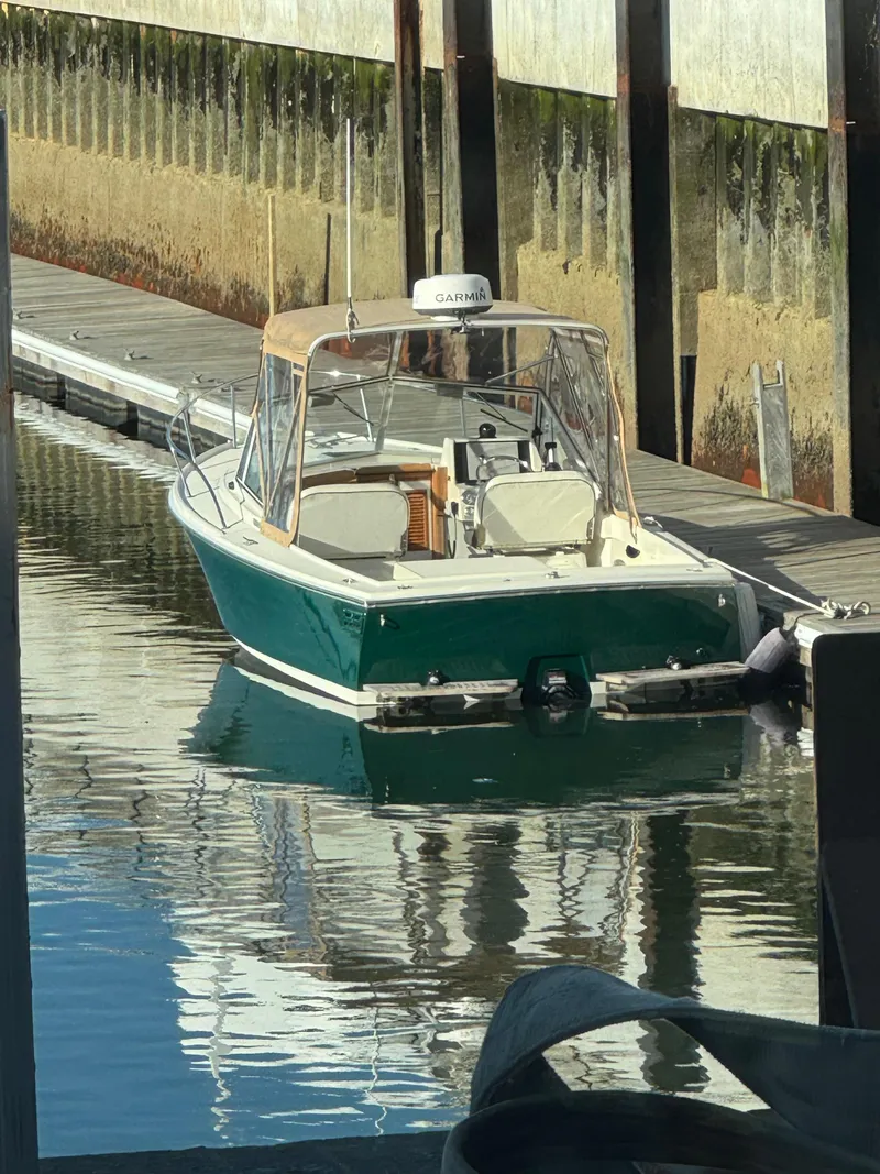 Slide: The Image of 2004 Limestone 24 Cuddy boat docked in a marina. - 4