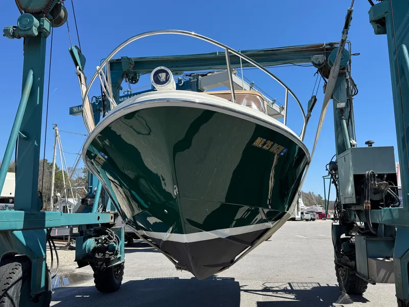 Slide: The Image of 2004 Limestone 24 Cuddy boat in dry dock, green hull, front view. - 5