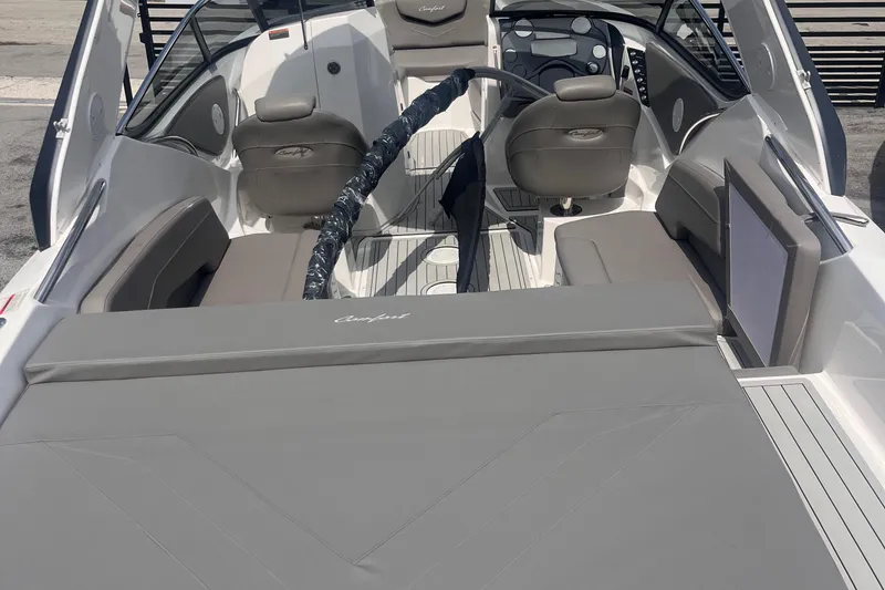 Slide: The Image of 2025 Ventura Comfort boat interior with gray seating and modern dashboard design. - 3