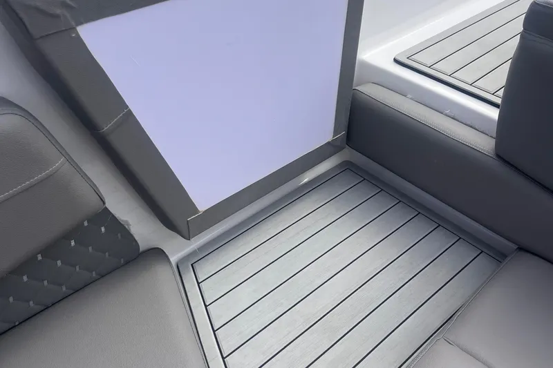 Slide: The Image of 2025 Ventura Comfort boat interior with sleek gray seating and modern flooring design. - 4