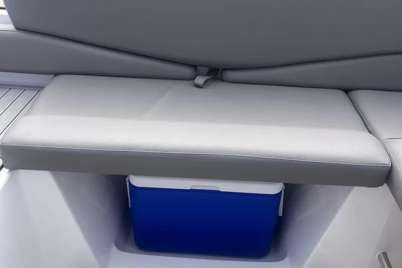 Slide: The Image of Ventura Comfort 2025 boat seat with storage compartment and blue cooler underneath. - 6