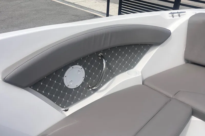 Slide: The Image of 2025 Ventura Comfort boat interior with gray cushioned seating and stylish paneling. - 9