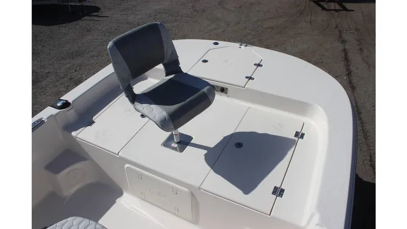 Slide: The Image of 2025 Carolina Skiff 19 LS boat with a single seat on the deck. - 10
