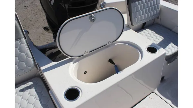 Slide: The Image of 2025 Carolina Skiff 19 LS boat interior with open storage compartment and seating. - 4