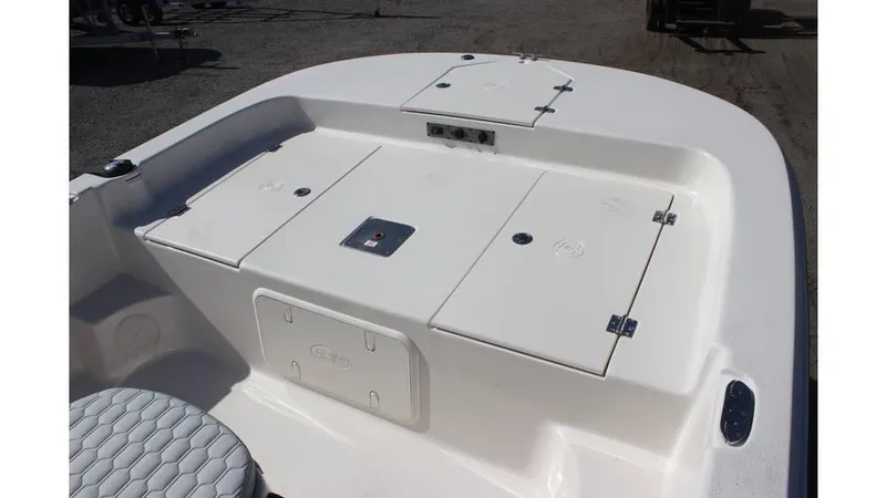 Slide: The Image of 2025 Carolina Skiff 19 LS boat deck with storage compartments and seating. - 7