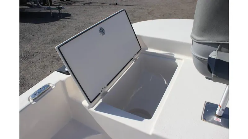 Slide: The Image of 2025 Carolina Skiff 19 LS boat storage compartment open on deck. - 8