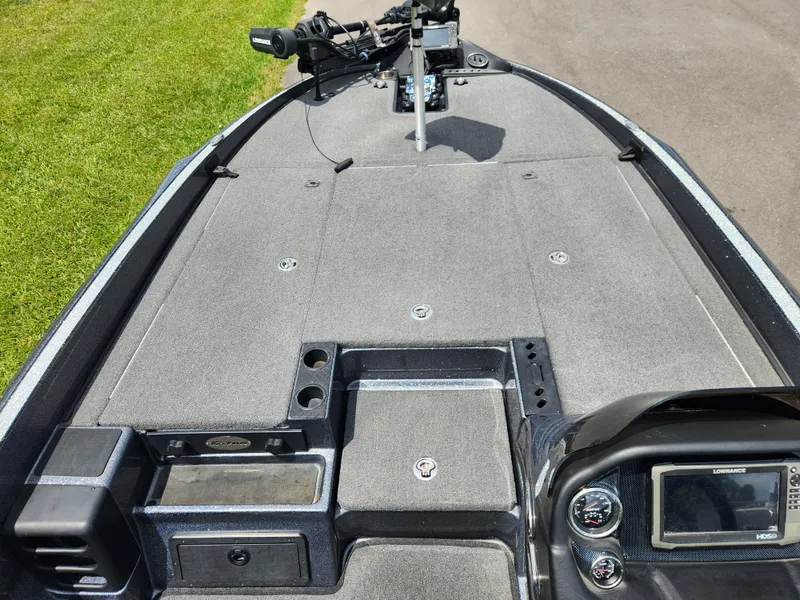 Slide: The Image of 2018 Triton 20 TRX boat deck with control panel and trolling motor. - 11