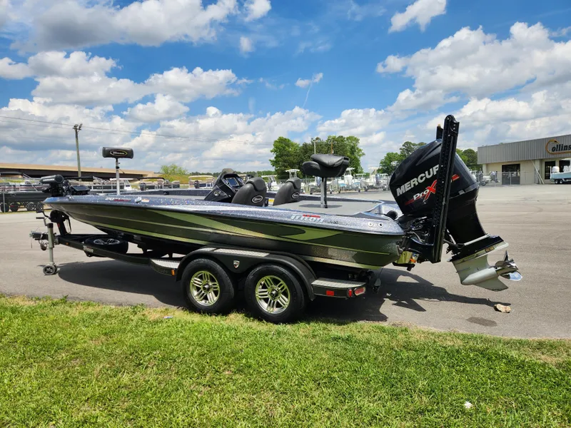 Slide: The Image of 2018 Triton 20 TRX boat with Mercury engine on trailer, parked outdoors. - 4