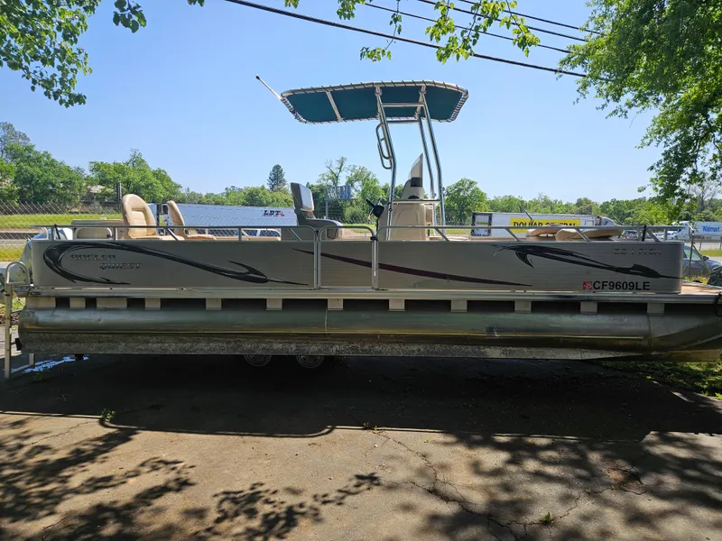 Slide: The Image of 2019 Apex Marine ANGERQWEST pontoon boat docked under trees, sunny day. - 11