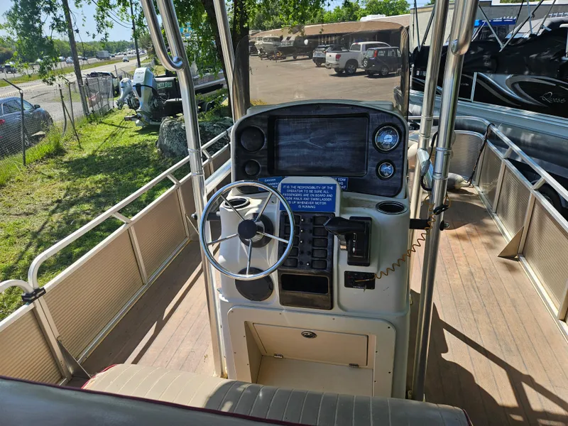 Slide: The Image of 2019 Apex Marine ANGERQWEST boat dashboard with steering wheel and control panel. - 16