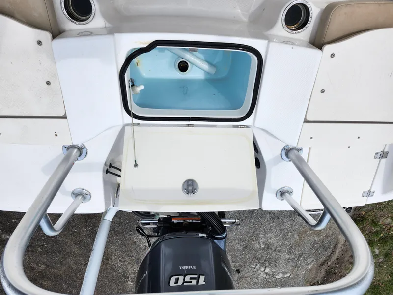 Slide: The Image of 2018 Robalo R180 Center Console boat with Yamaha 150 engine, featuring a livewell and swim platform. - 11