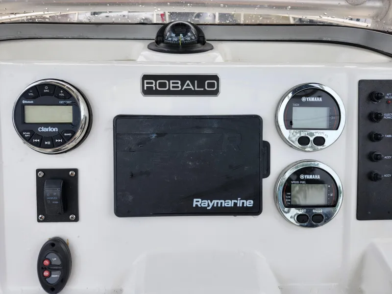 Slide: The Image of Control panel of 2018 Robalo R180 Center Console with Raymarine and Yamaha displays. - 19