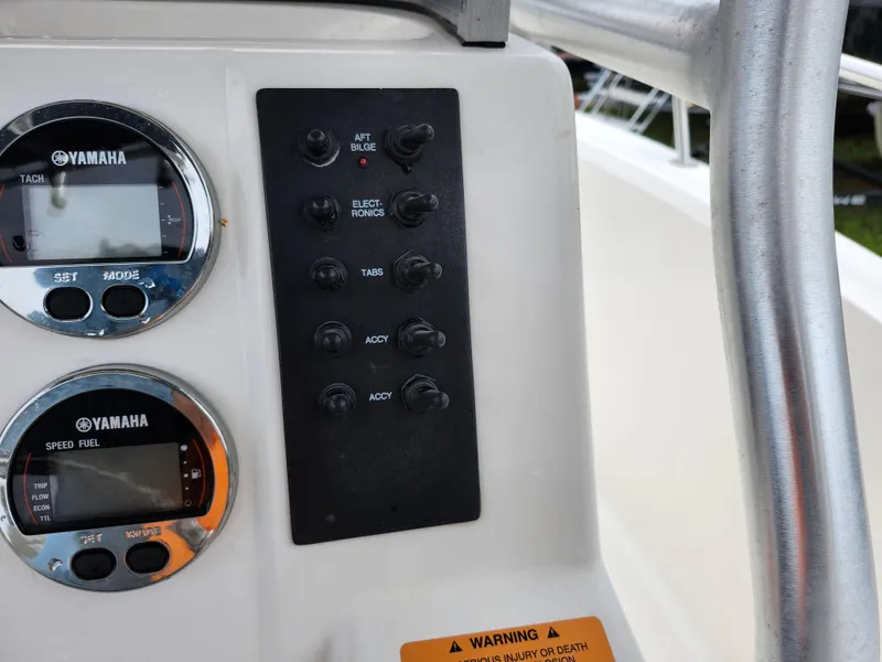 Slide: The Image of 2018 Robalo R180 Center Console dashboard with Yamaha gauges and control panel. - 20