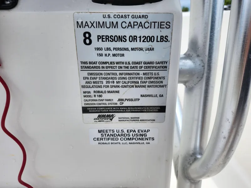 Slide: The Image of 2018 Robalo R180 Center Console capacity label, 8 persons or 1200 lbs, U.S. Coast Guard compliant. - 21