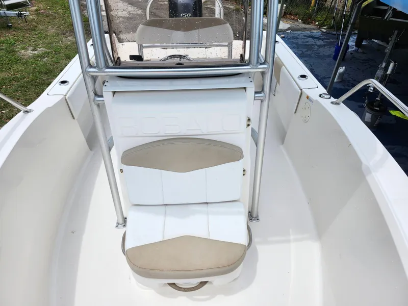 Slide: The Image of 2018 Robalo R180 Center Console boat interior with seating and console view. - 22