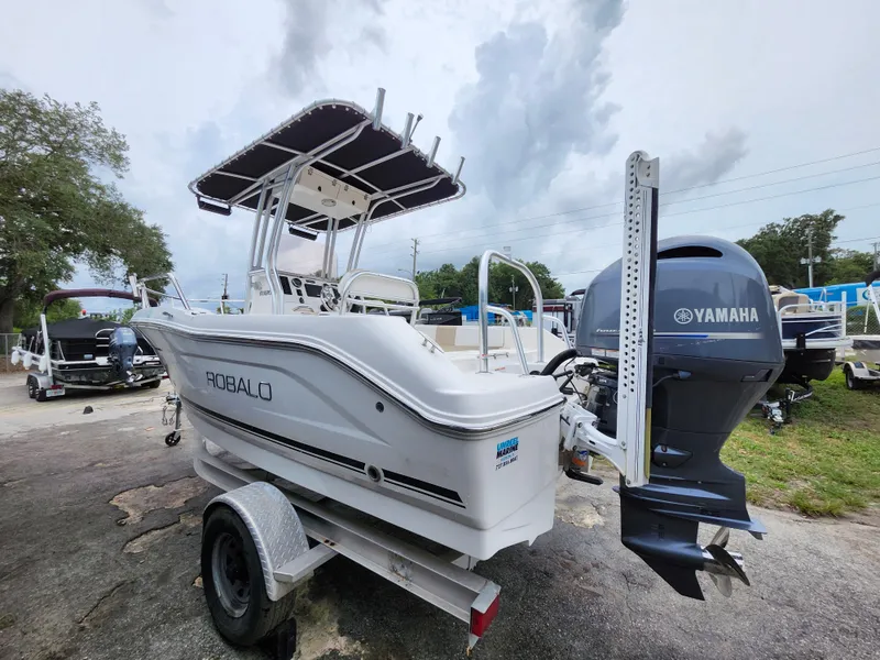 Slide: The Image of 2018 Robalo R180 Center Console boat with Yamaha engine on trailer. - 4