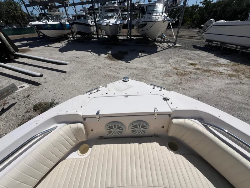 Slide: The Image of Bow seating area of a 2006 Grady-White Freedom 225 boat, with speakers and cup holders. - 9