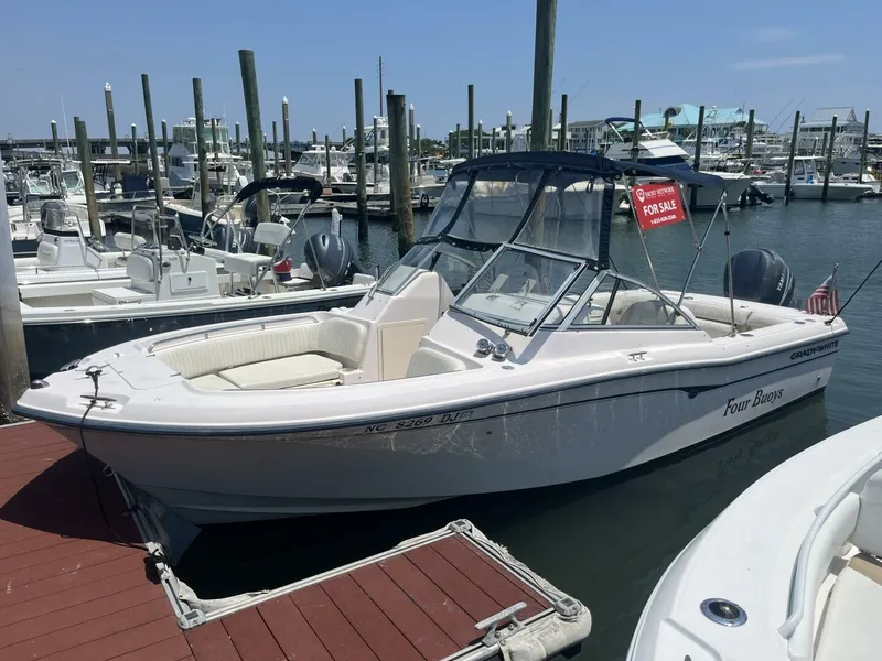 The Image of 2008 Grady-White 225 Tournament boat docked, for sale sign visible. - 1