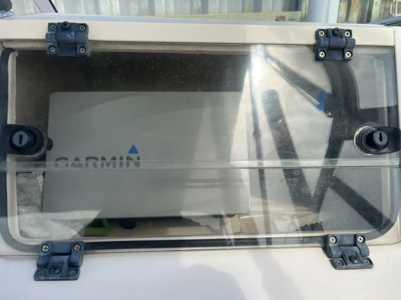 Slide: The Image of Clear protective cover on a 2008 Grady-White 225 Tournament boat, housing Garmin equipment. - 11