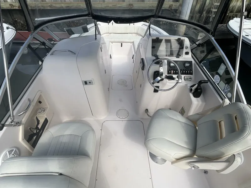 Slide: The Image of 2008 Grady-White 225 Tournament boat interior with steering wheel and seating. - 20