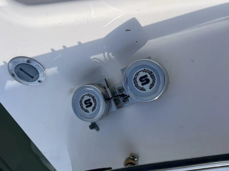 Slide: The Image of 2008 Grady-White 225 Tournament boat detail with dual metal fixtures and logo. - 8