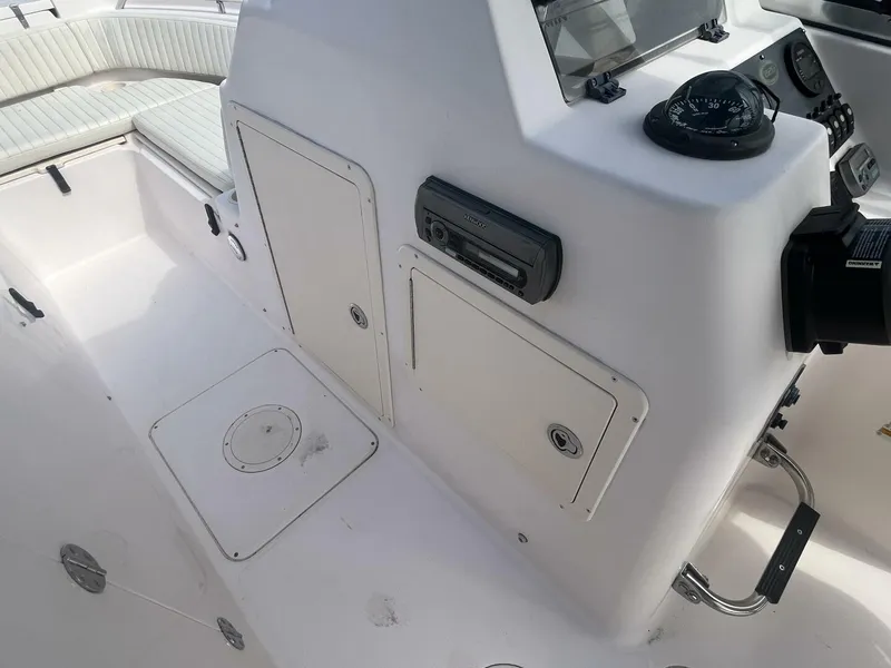 Slide: The Image of 2008 Grady-White 225 Tournament boat interior with control panel and seating area. - 9