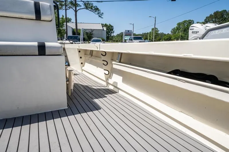 Slide: The Image of 2018 Encore Boat Works 25 Custom interior with seating and storage compartments. - 16