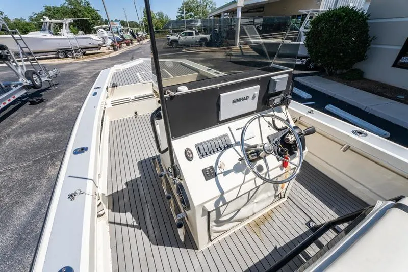 Slide: The Image of 2018 Encore Boat Works 25 Custom, featuring a sleek helm and spacious deck. - 20