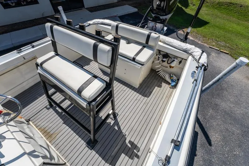 Slide: The Image of 2018 Encore Boat Works 25 Custom interior with seating and deck view. - 22