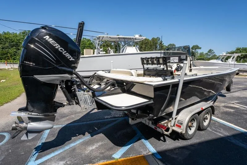 Slide: The Image of 2018 Encore Boat Works 25 Custom on trailer with Mercury outboard motor. - 7