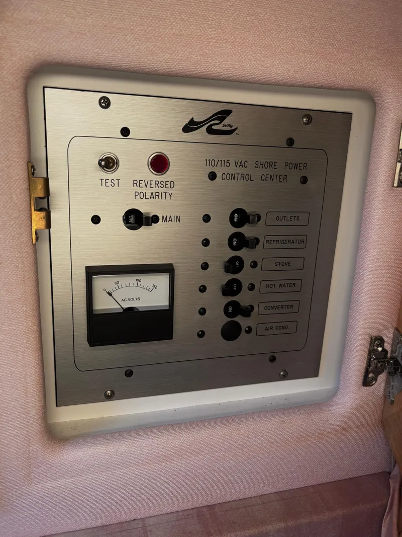 Slide: The Image of 1989 Sea Ray Sundancer electrical control panel with reversed polarity test feature. - 15